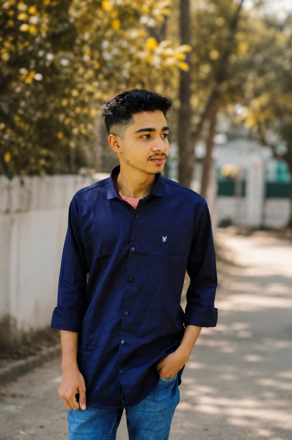 Faisal Hossen standing outdoors in a navy shirt